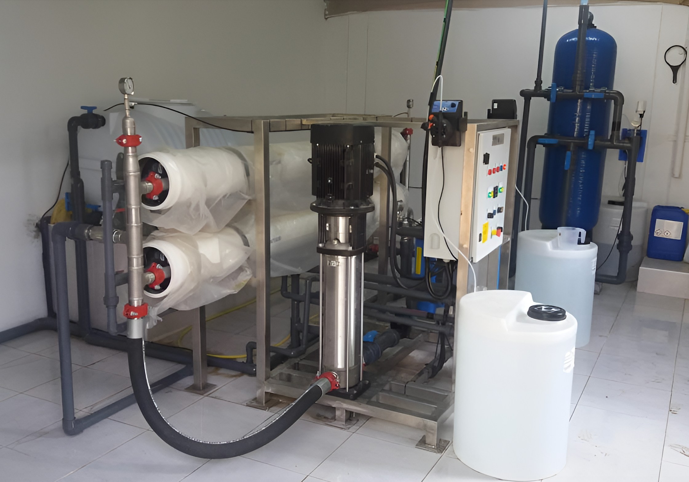 Professional water treatment system installation with RO membranes, pumps, and filtration equipment